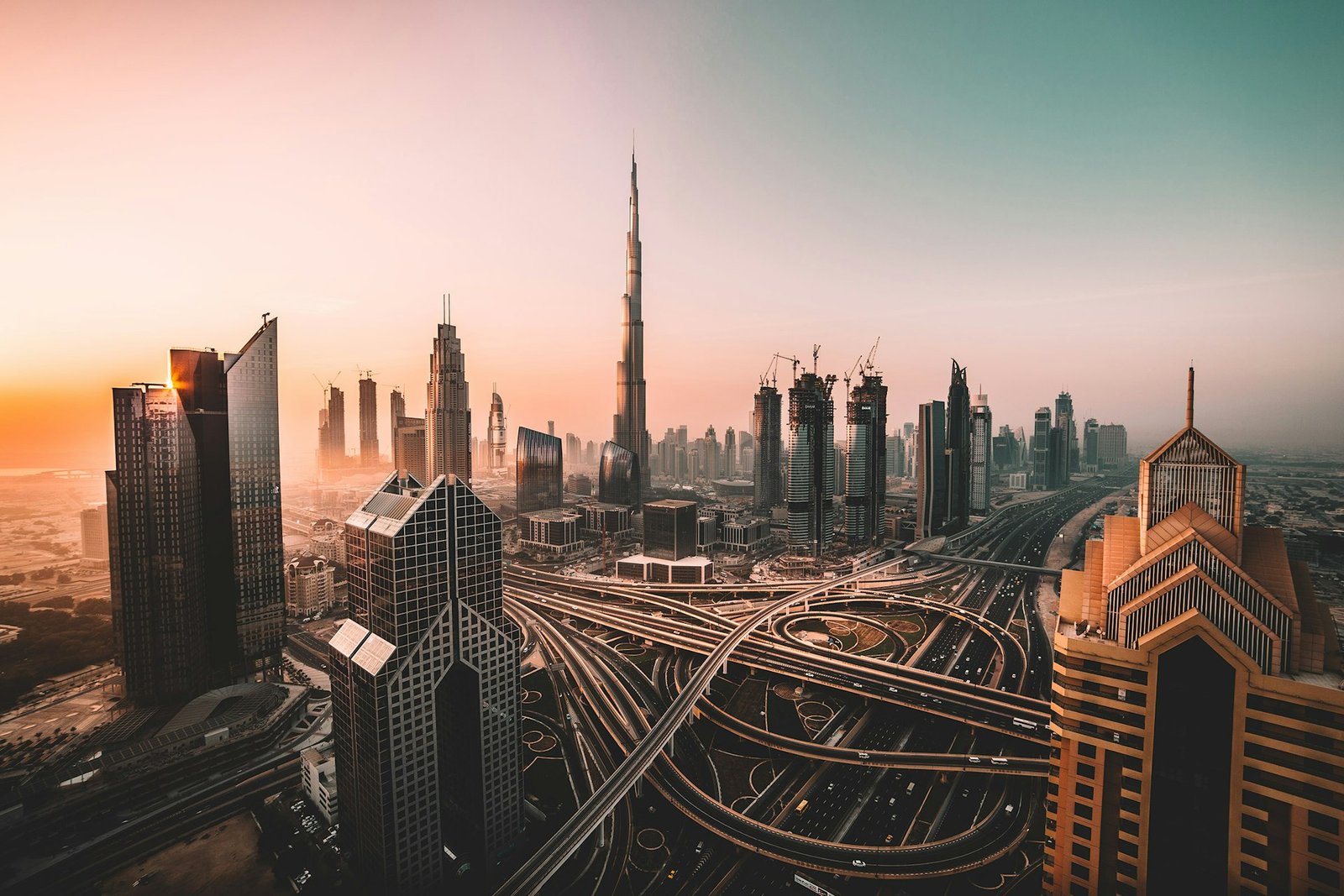Dubai skyline at dusk with towers reflected in still water