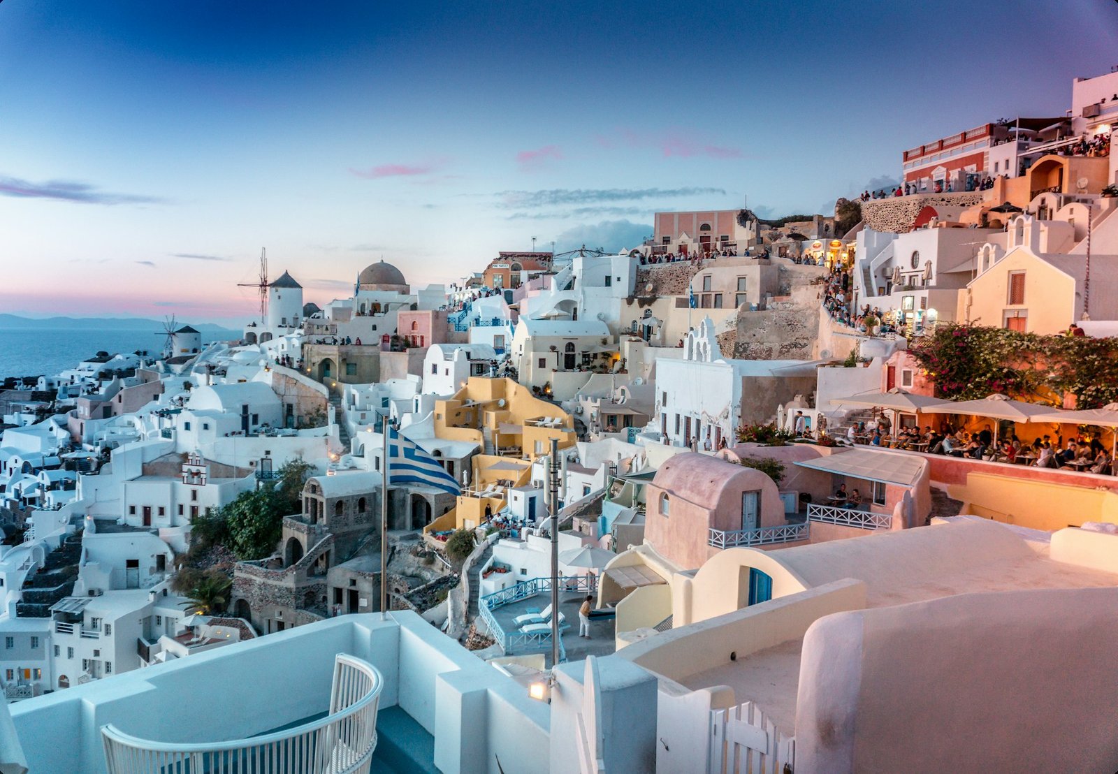 Whitewashed Santorini cliff houses above the blue Aegean caldera