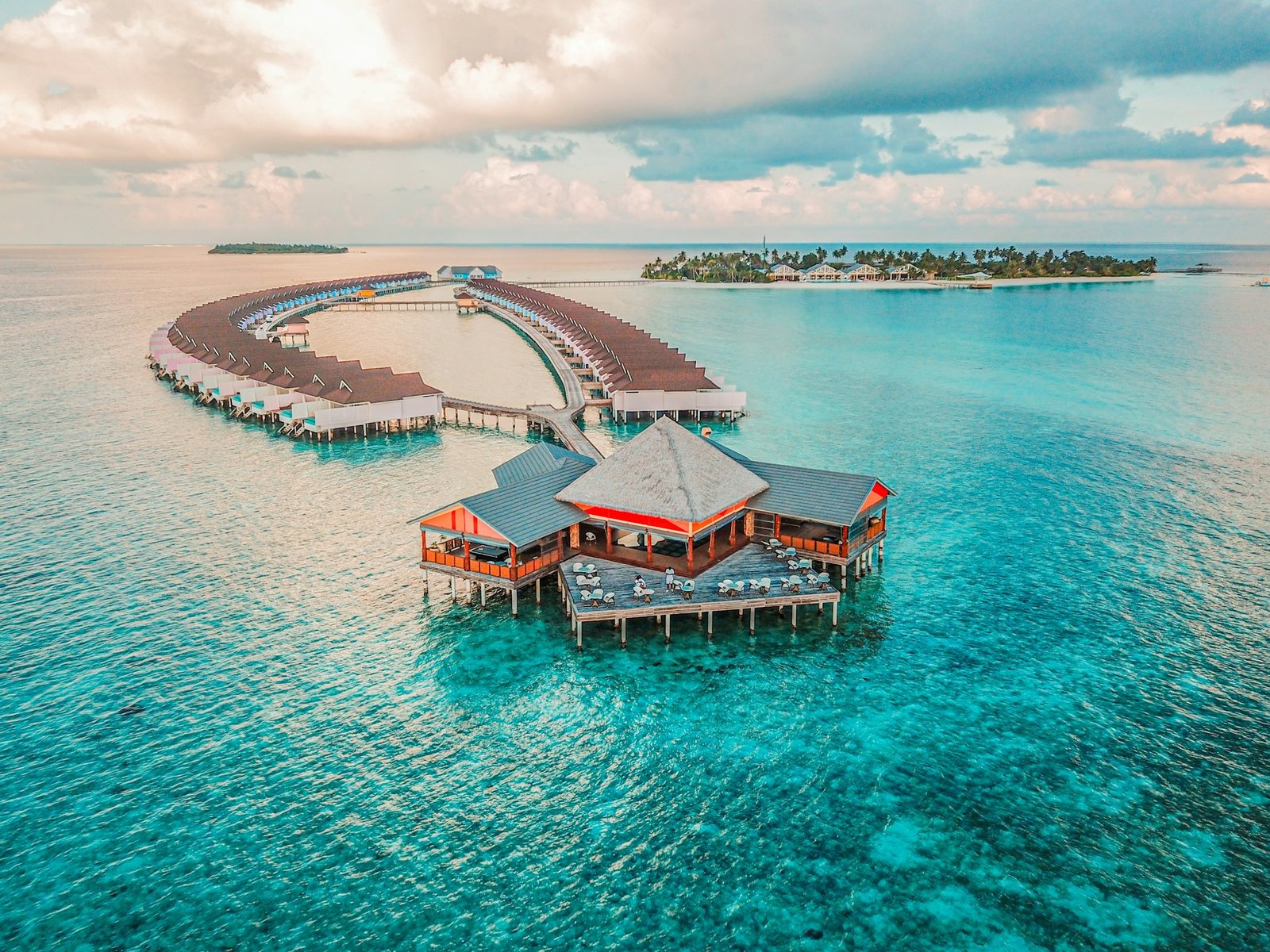 Aerial turquoise atolls at dusk